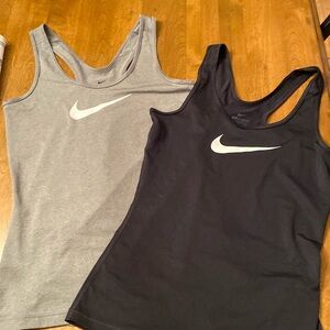 Two Nike dri-fit exercise tops.